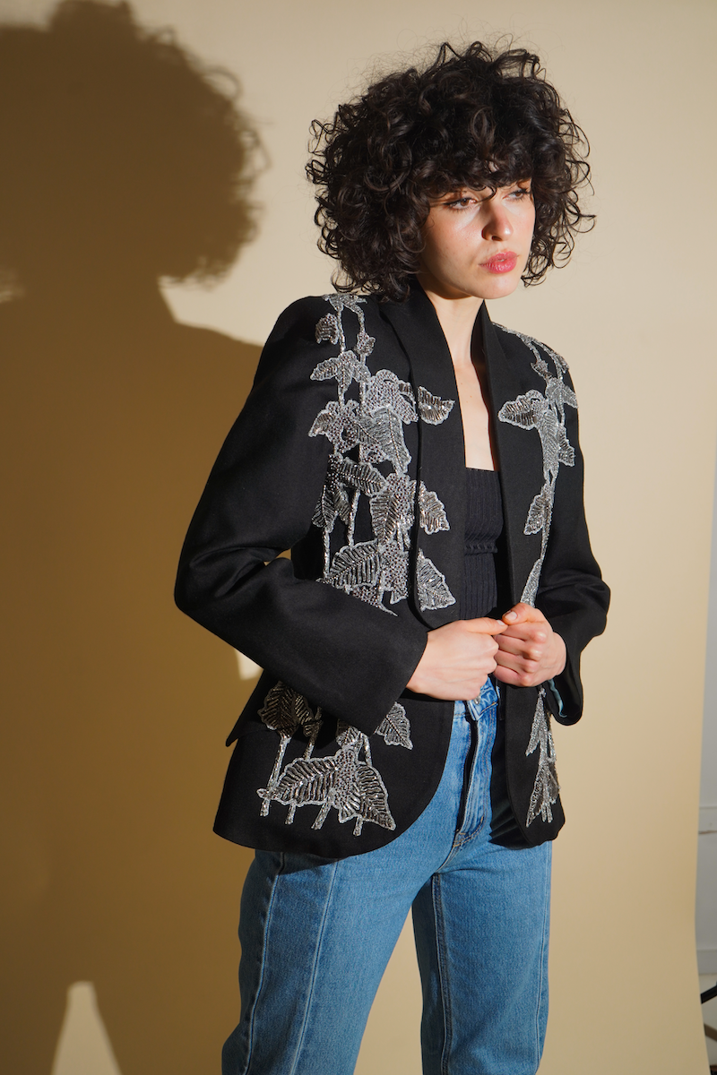 Black beaded blazer by Nadya Shah with intricate bead detailing, tailored fit, and stylish lapels, perfect for elegant occasions.
