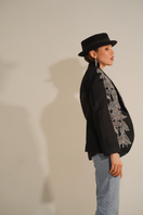 Nadya Shah Agnes black beaded blazer featuring intricate beadwork, tailored fit, and stylish lapel collar on a model.