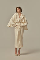 White POEM AILE coat displayed on a model, showcasing a stylish and elegant outerwear piece.