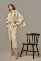 White AILE coat by POEM, stylish long coat with a tailored fit, displayed on a model.