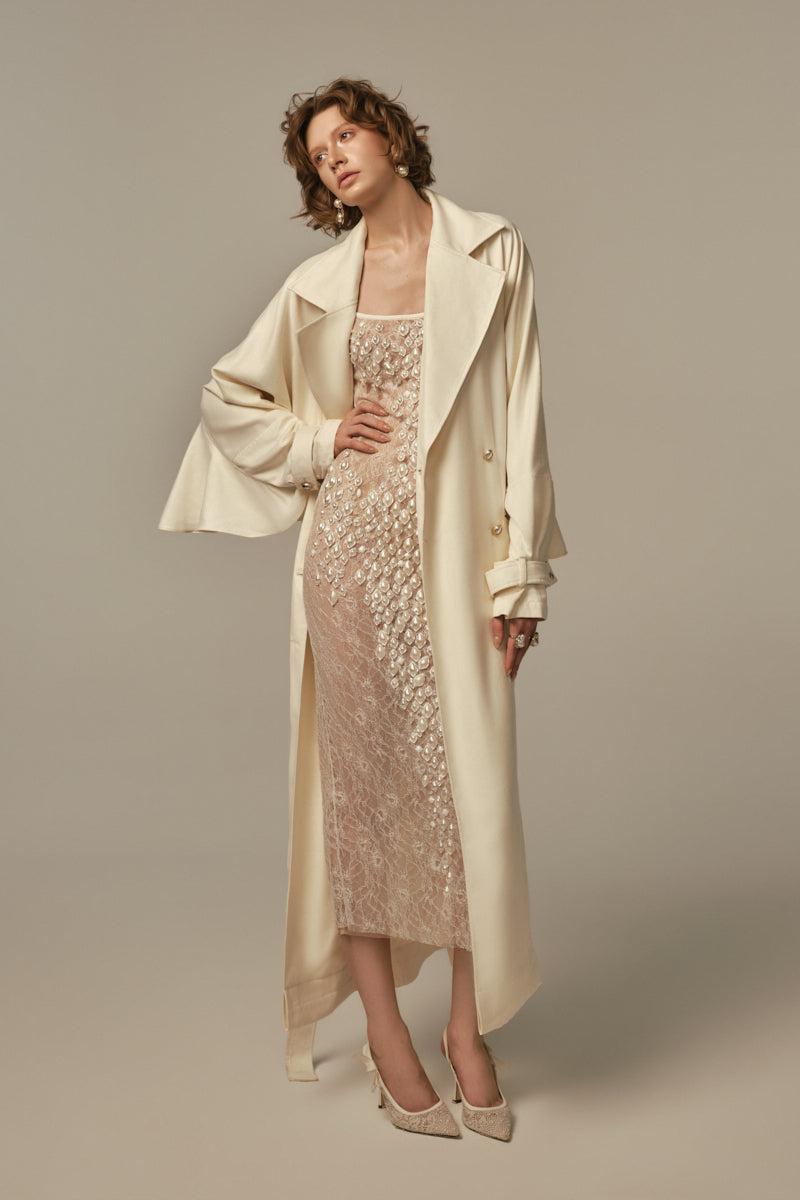 White AILE coat by POEM, stylish and warm outerwear displayed on a model, featuring a sleek design and tailored fit.