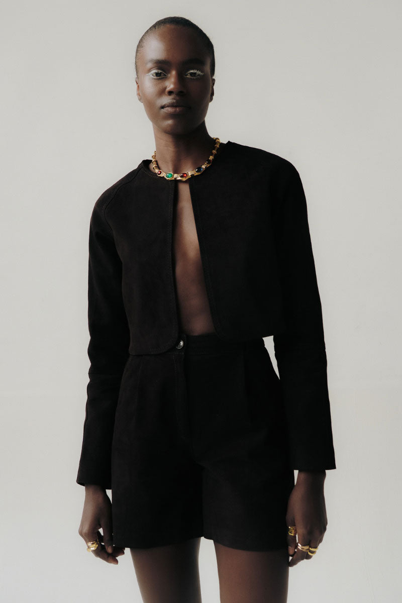 ZUT Aimaran chocolate jacket, stylish outerwear with a sleek design, displayed on a hanger against a neutral background.