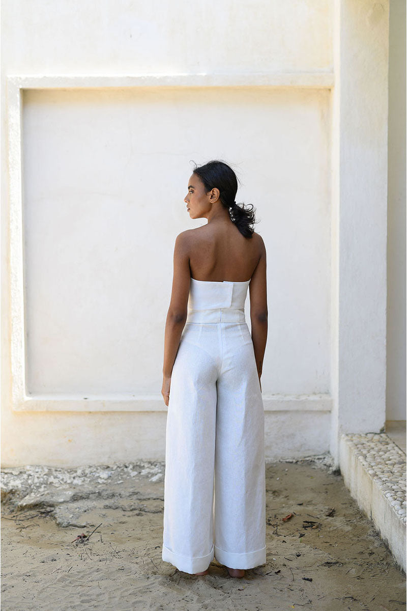 Off-white Alana bustier top by ANA + MARIA displayed on a mannequin, showcasing fitted design and elegant straps.