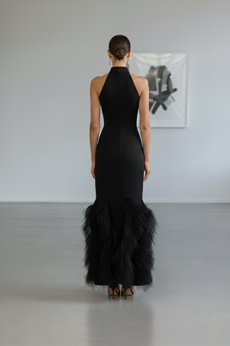 Elegant black Alara gown by Nana Gotti featuring a flowing silhouette and stylish design, perfect for formal occasions.