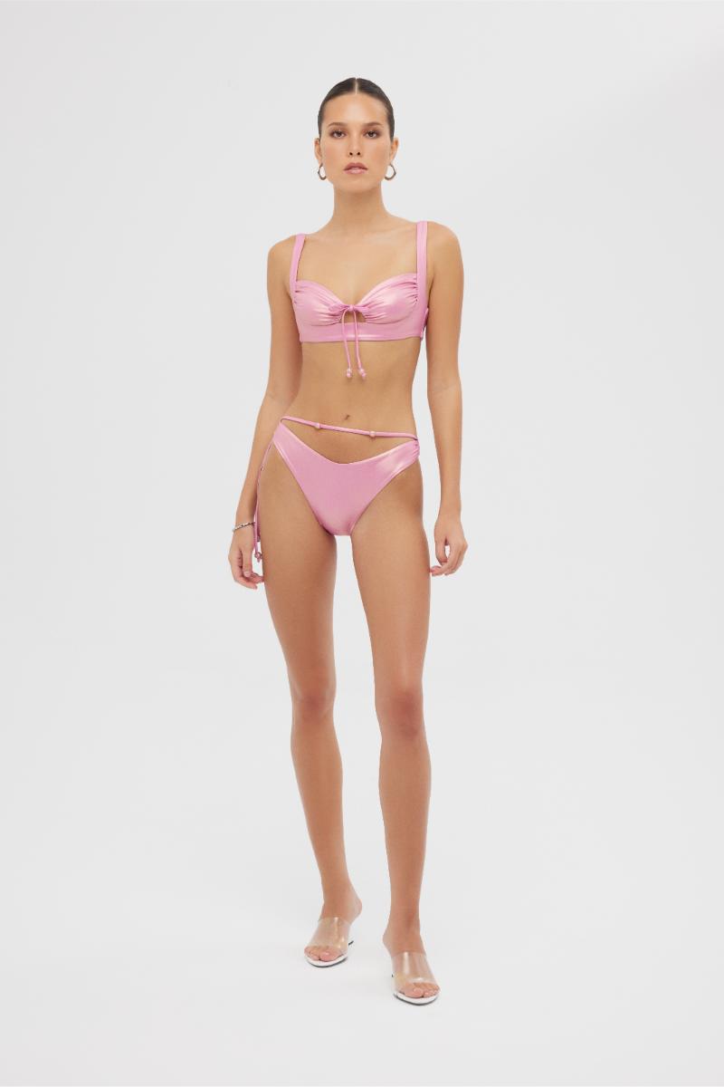Shiny pink Albina bikini set by Maliluha featuring a supportive top and matching bottoms on a neutral background.