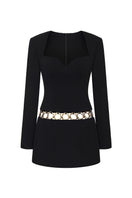 Black Alejandra dress by Nana Jacqueline, a stylish mini dress with a ring cutout design, shown from the front.