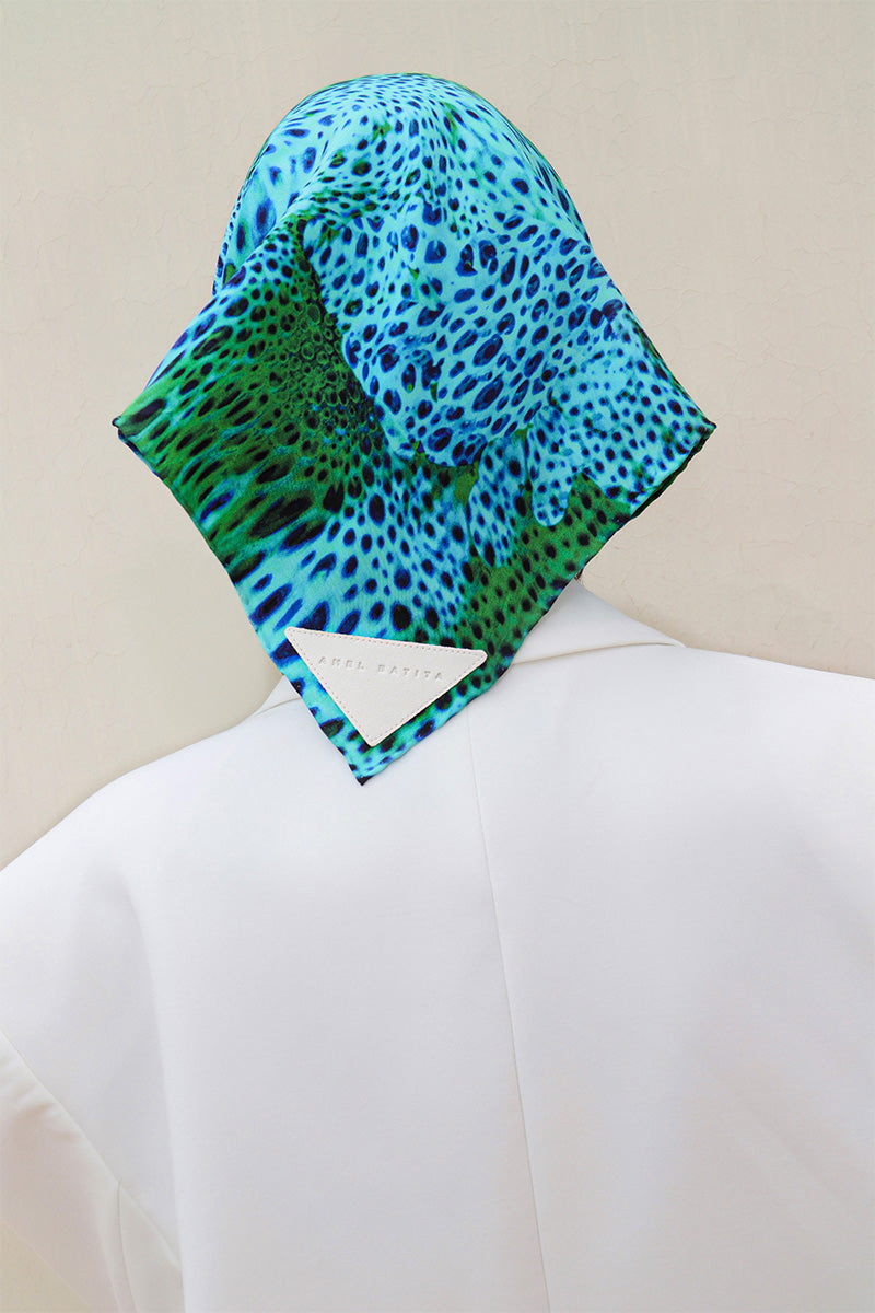 Amel Batita Alga Moussard silk scarf featuring vibrant blue and yellow floral patterns on a lightweight fabric.