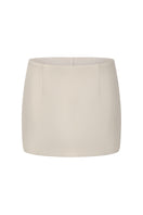 Nana Jacqueline Alina Champagne mini skirt shown from the front, featuring a sleek, straight design in a soft champagne color.