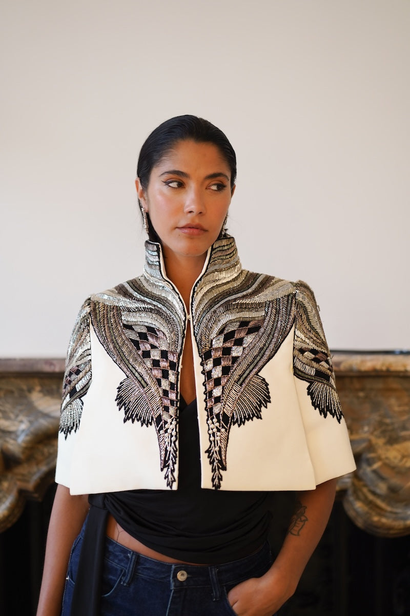 Ivory All About Eve capelet jacket by Nadya Shah, featuring lightweight fabric and elegant design, perfect for layering.