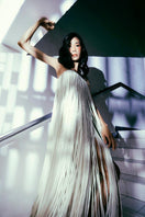 White Valenciani all-over fringed maxi dress with flowing fabric and fringe details, perfect for elegant summer occasions.