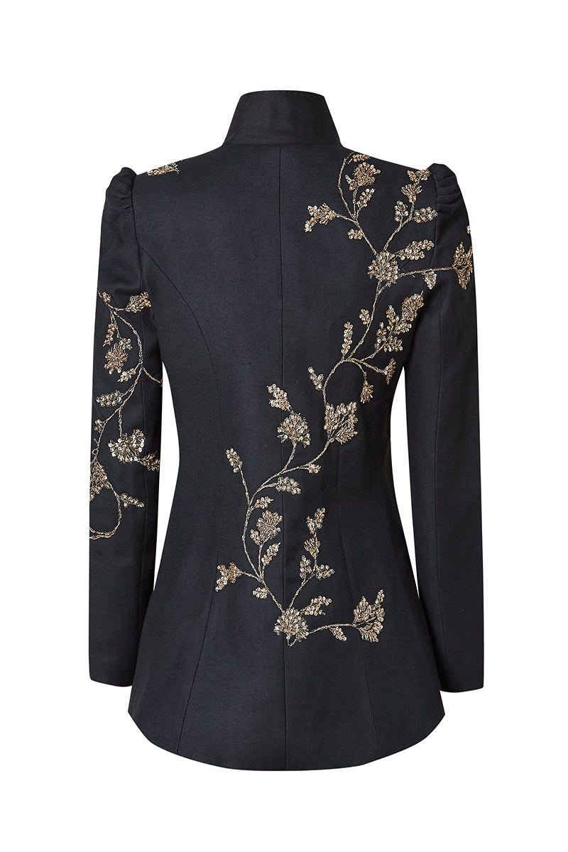 Nadya Shah Allegra Rose jacket displayed on a mannequin, showing the back view with floral rose pattern and stylish design.