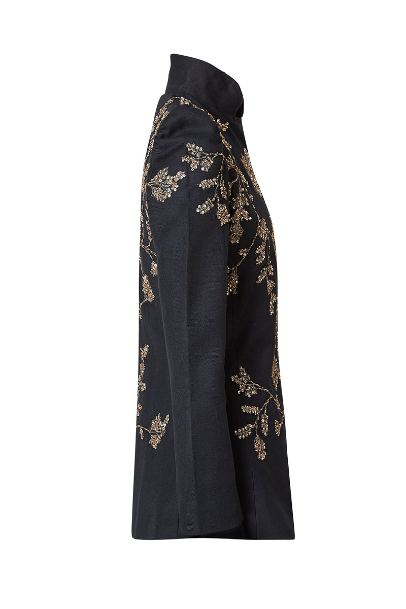 Nadya Shah Allegra Rose Jacket shown from the side on a mannequin, featuring a stylish design and vibrant rose pattern.