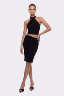 Black Alma asymmetric midi skirt by Nana Jacqueline, featuring a stylish, flowy silhouette and unique hem design.
