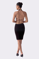 Black Alma halter top by Nana Jacqueline featuring a stylish design, displayed on a model in a fashion lookbook image.