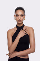 Black Alma halter top by Nana Jacqueline, shown on a model, featuring a stylish and elegant sleeveless design for women.