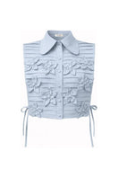 Light blue Almar bib top by ANA + MARIA, featuring a ghost design, showcased on a model.