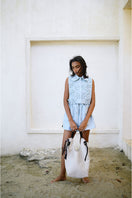 Light blue Almar Bib top by ANA + MARIA, featuring a stylish and comfortable design with detailed stitching.