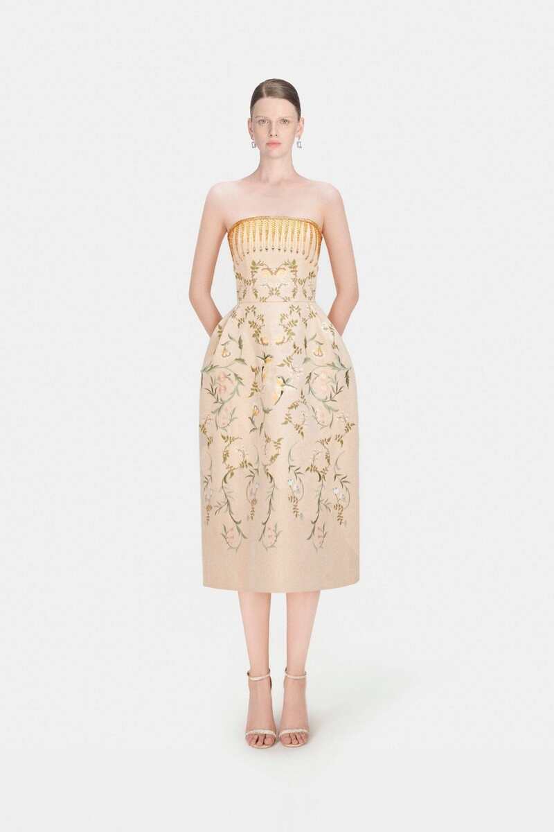 Elegant Montsand Almira gown featuring a flowing midi dress with intricate detailing and a sophisticated silhouette.
