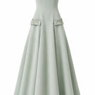 Green Aloe dress by Nihan Peker, elegant gown with flowing fabric and subtle detailing, perfect for formal occasions.
