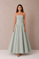 Green Aloe Dress gown by Nihan Peker featuring flowing fabric and elegant design, perfect for formal occasions.