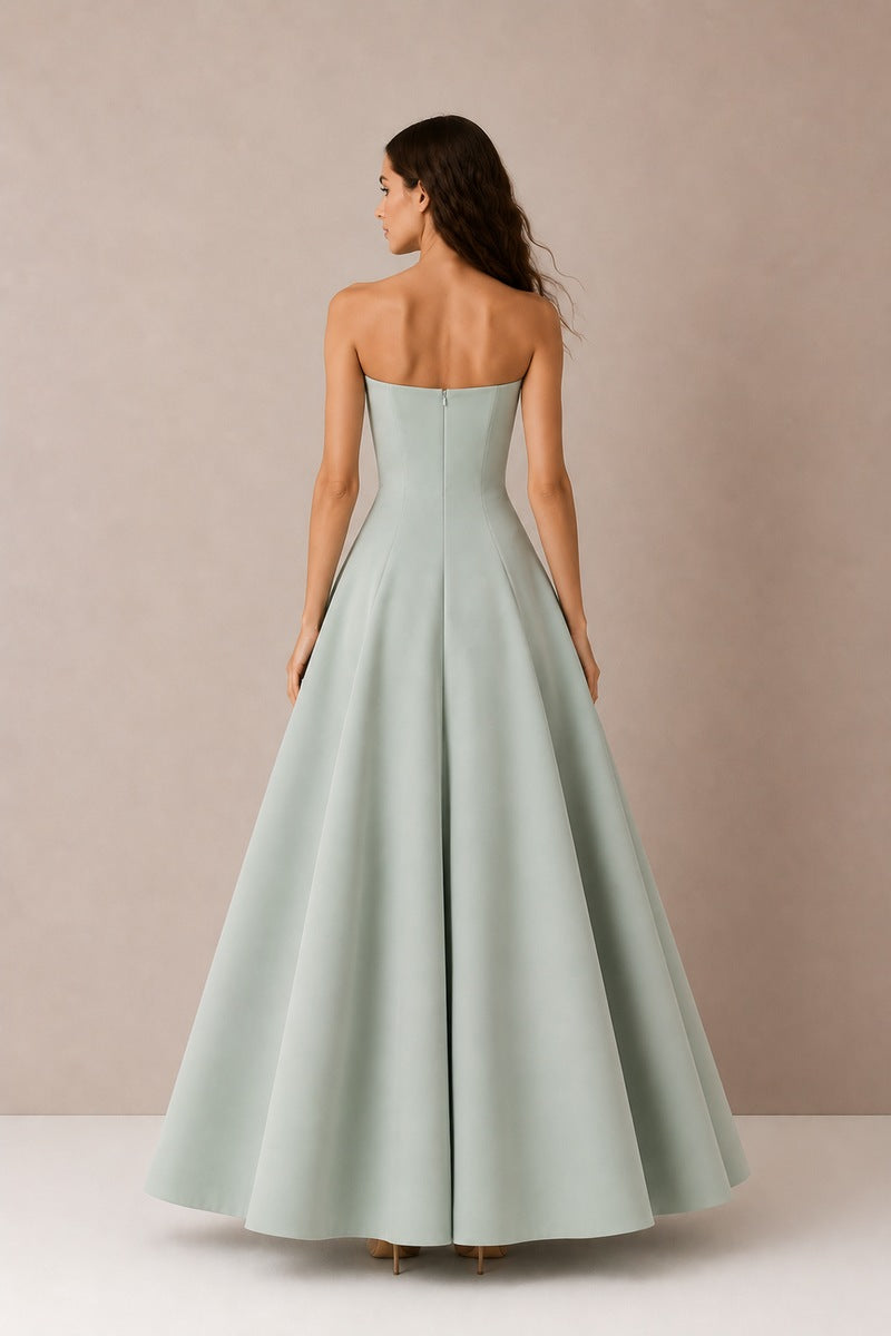 Green Aloe dress gown by Nihan Peker, flowing fabric with elegant design, showcased on a model.
