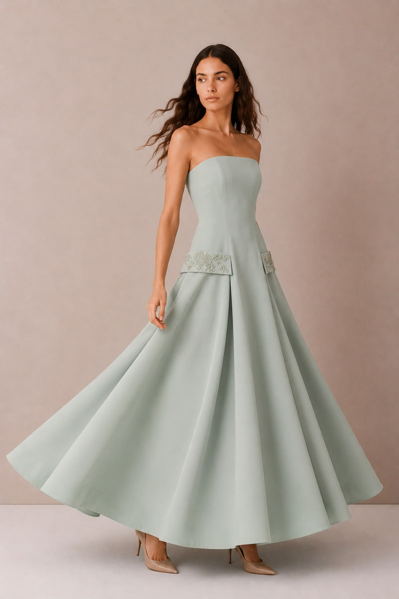 Green Aloe Dress gown by Nihan Peker featuring flowing fabric and elegant design, perfect for formal occasions.