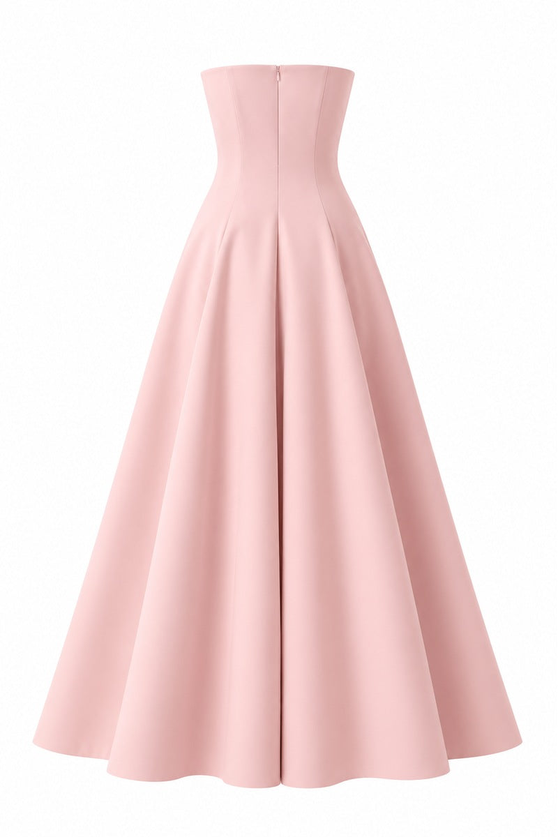Light pink Aloe dress gown by Nihan Peker, flowing fabric with elegant design, displayed on a hanger.