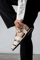 Off-white ALTA Cecilia sandals with open toes and ankle straps, stylish summer footwear on a white background.