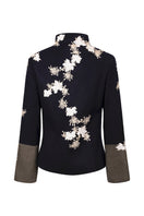 Nadya Shah Alto Mare jacket displayed on a mannequin, showcasing the back view with stylish waterproof fabric and modern design.