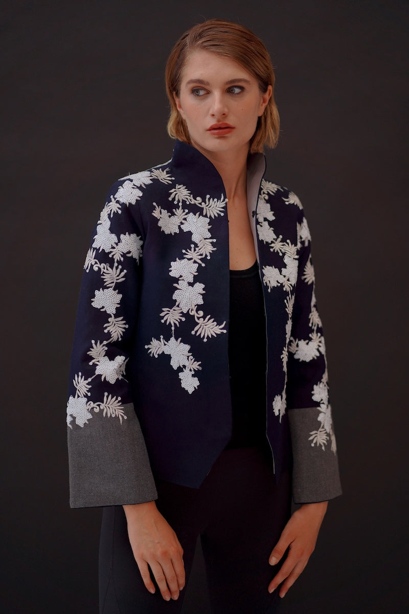 Nadya Shah Alto Mare jacket in navy, lightweight with a zip-up front and adjustable hood, perfect for casual wear.
