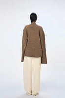 Taupe URA Alva Jumper sweater with a cozy knit texture, featuring a relaxed fit and ribbed cuffs.