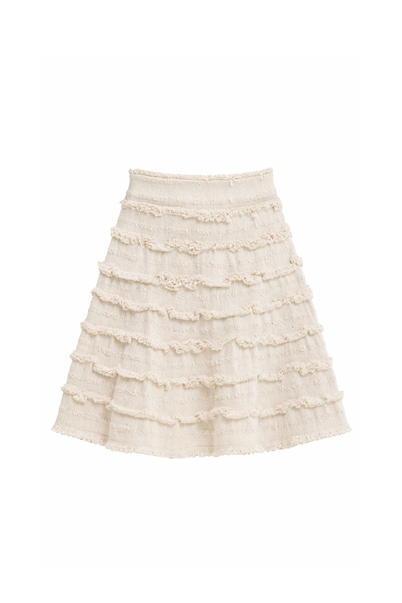 Maylé Vásquez Alya mini skirt in nature print, lightweight fabric with a fitted waist and stylish design, displayed on a mannequin.