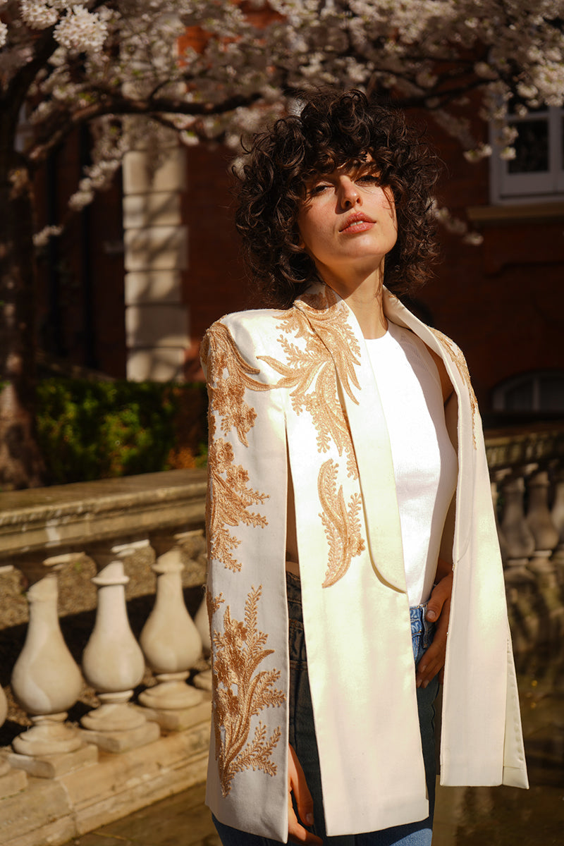 Ivory Alya tuxedo cape by Nadya Shah, stylish jacket with elegant design, shown on a neutral background.