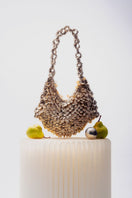 Beige Alya sequin shoulder bag by Millanne Tale with off-white tone, featuring a stylish design and shoulder strap.