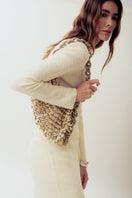 Beige Alya off-white sequin shoulder bag by Millanne Tale with elegant strap and sparkling embellishments.