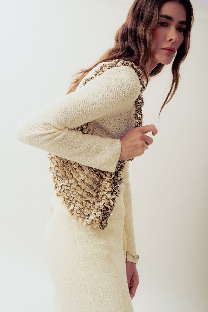 Beige Alya off-white sequin shoulder bag by Millanne Tale with elegant strap and sparkling embellishments.