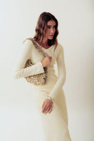 Beige Alya off-white sequin shoulder bag by Millanne Tale with a stylish strap and shimmering sequin design.