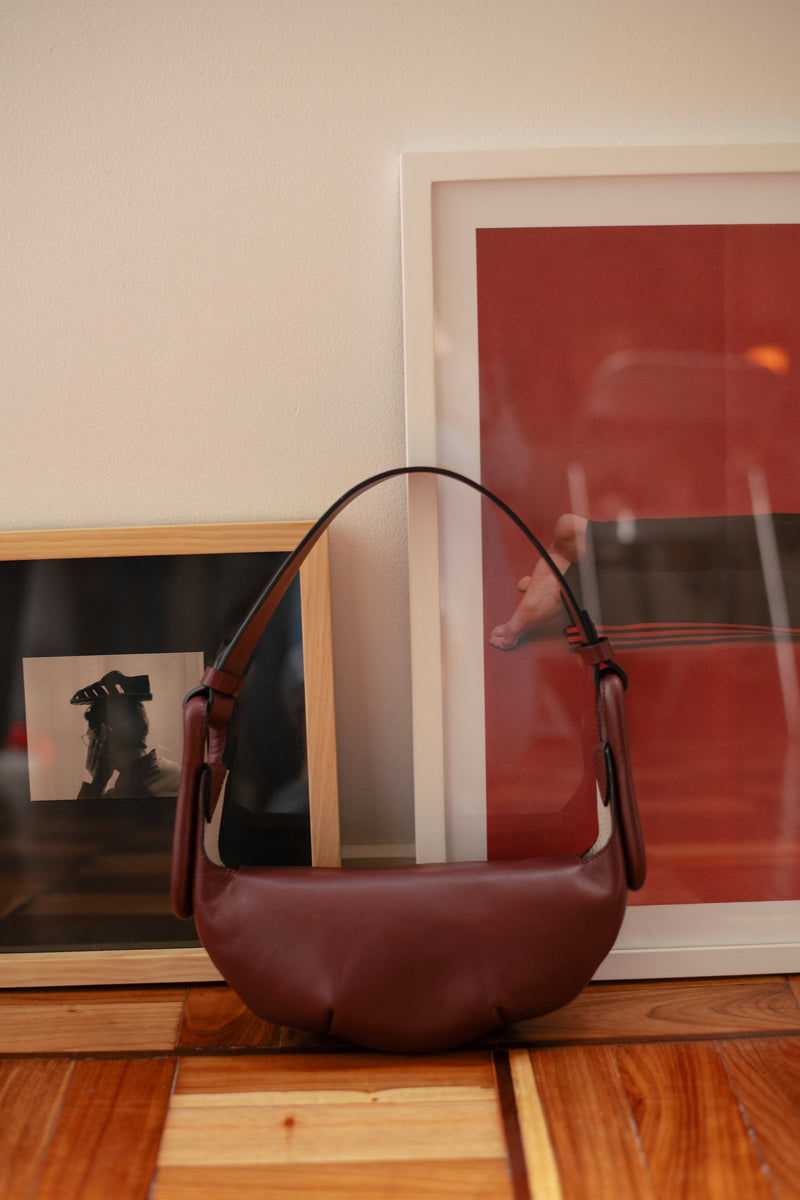 ISIDORA MALVA Amalfi Mini Burgundy shoulder bag with sleek design and top handle, perfect for stylish everyday use.