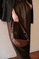 ISIDORA MALVA Amalfi Mini shoulder bag in rich chocolate color, crafted with smooth leather and compact design.