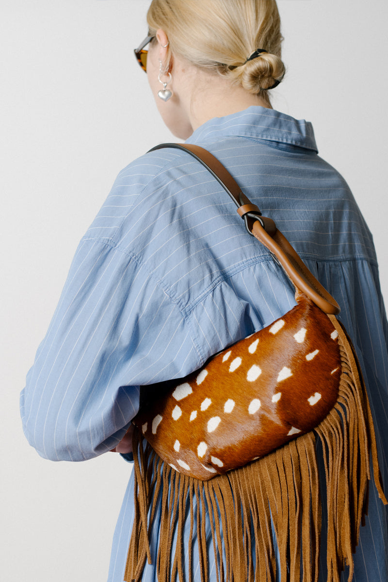 ISIDORA MALVA Almalfi fringes shoulder bag in Bambi color with stylish fringe details and compact design.