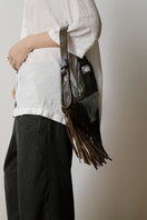 ISIDORA MALVA Amalfi mini shoulder bag with crocodile-embossed fringes, stylish and compact accessory for everyday use.