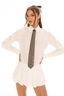 White Nana Jacqueline Amber mini skirt displayed on a model, showcasing its stylish fit and sleek design.