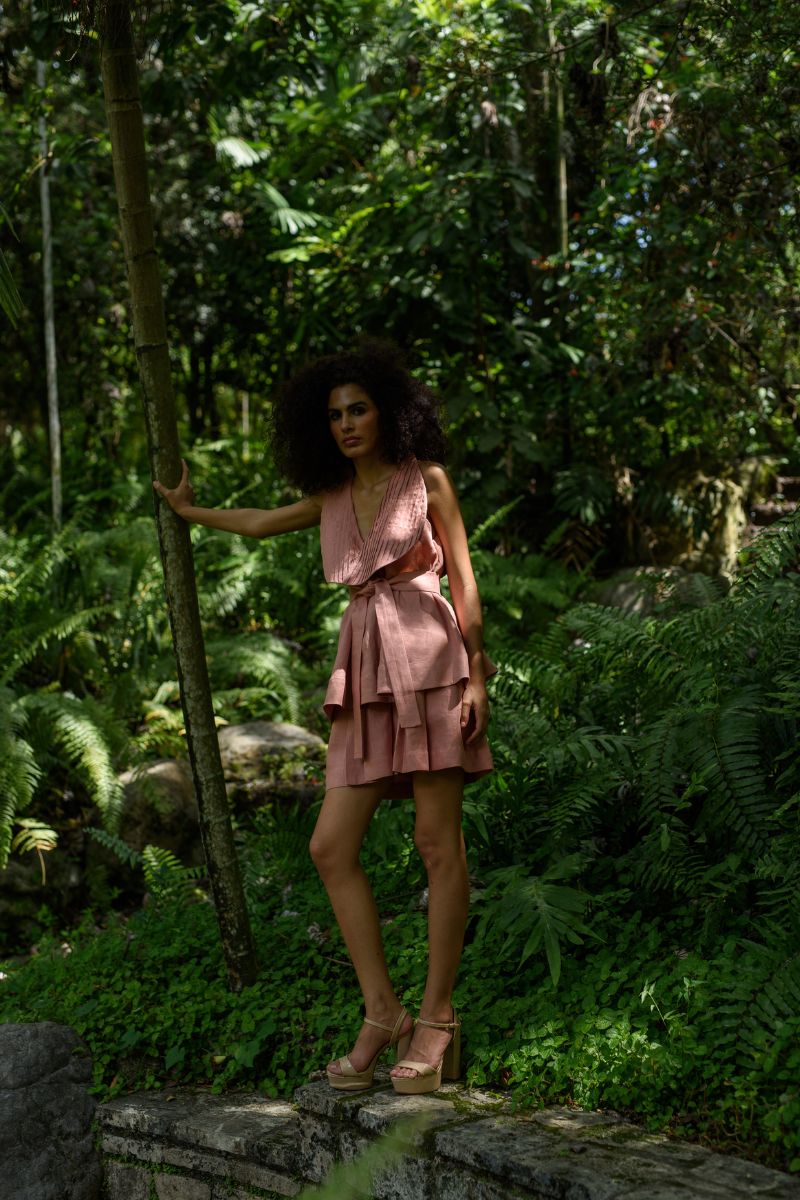 ANA + MARIA Amelie shorts in dark salmon, stylish casual shorts displayed on a model in a fashion campaign photo.