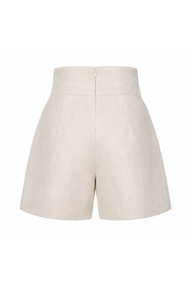 ANA + MARIA Amelie shorts in sand color displayed on a mannequin, showcasing the relaxed fit and lightweight fabric.