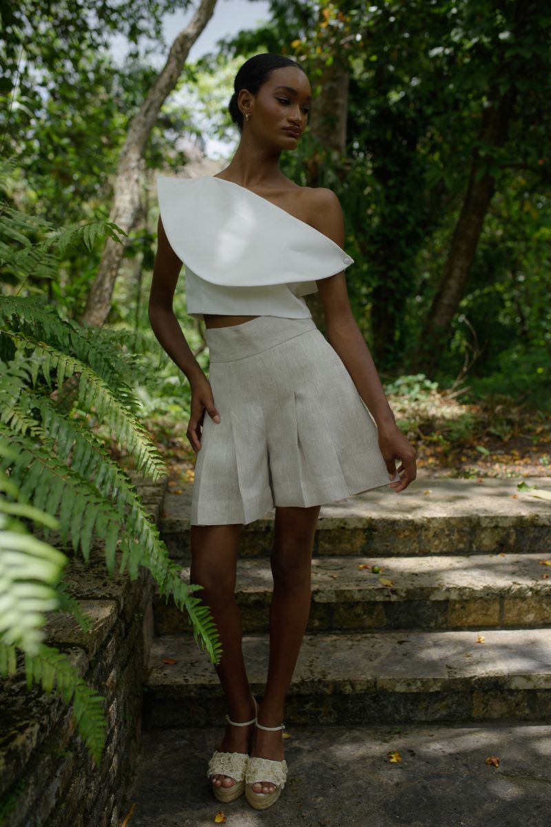 Ana + Maria Amelie Shorts in sand color, casual summer shorts with a relaxed fit, shown on a model in a campaign photo.