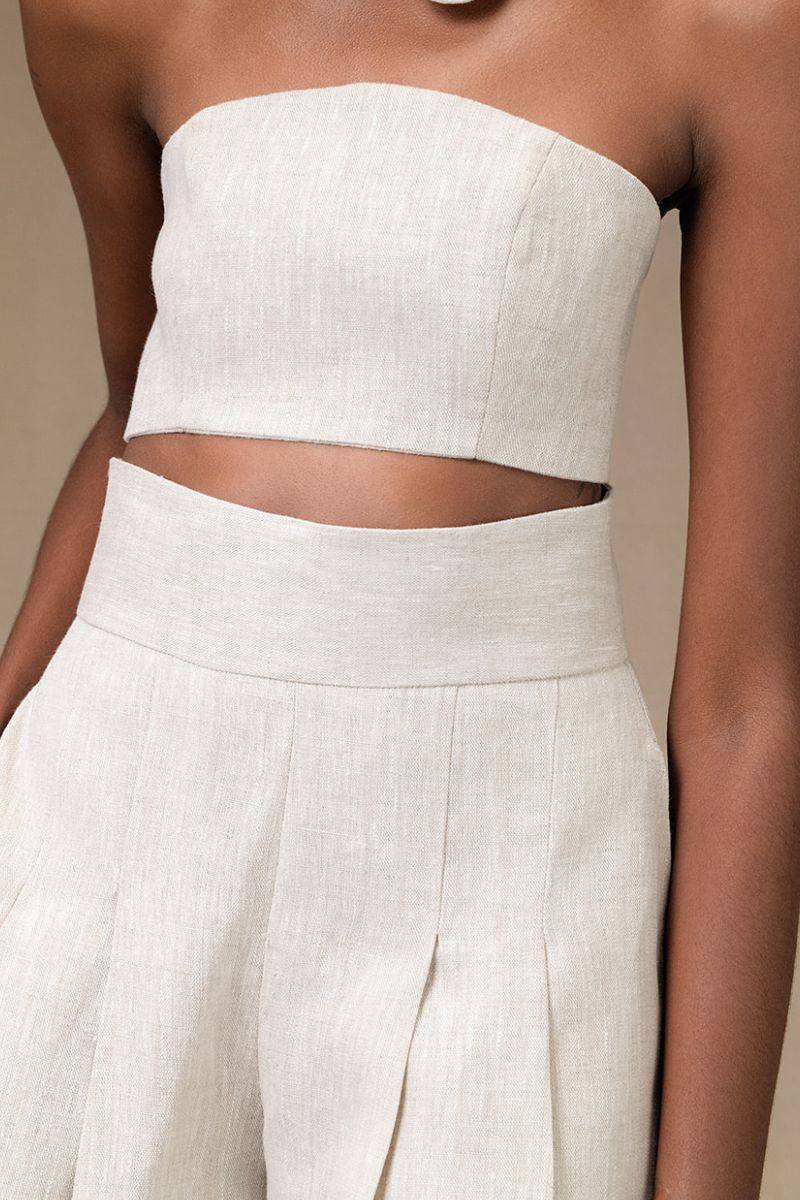 Light tan Amelie shorts in sand color by ANA + MARIA, shown on a model with a casual fit and relaxed style.