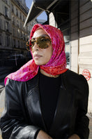 Amel Batita Amore Moussard silk scarf featuring vibrant floral patterns and elegant draping.