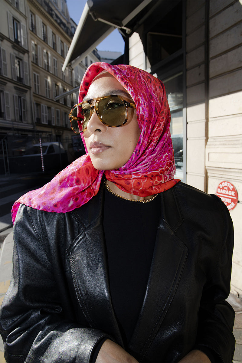 Amel Batita Amore Moussard silk scarf featuring vibrant floral patterns and elegant draping.