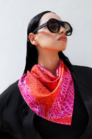 Amel Batita Amore Moussard small silk scarf draped around neck, featuring elegant pattern and vibrant colors.