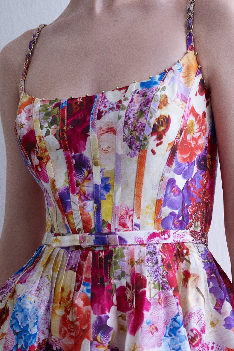 AISA Anemone midi dress featuring a flowy fabric and floral pattern, displayed on a hanger against a neutral background.